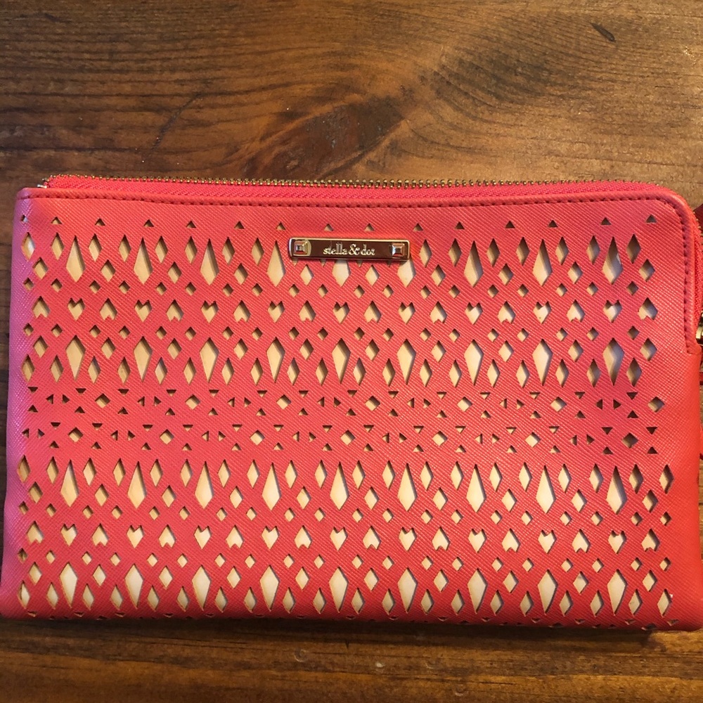 Stella and Dot tangerine color clutch. Never used.